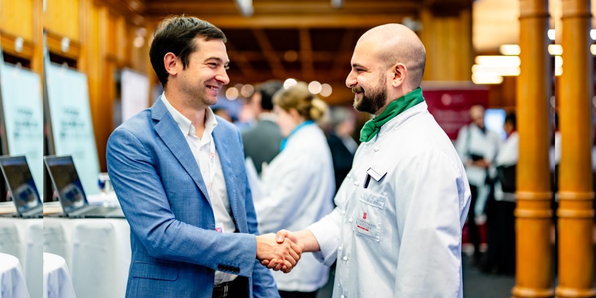 pastry chef shaking hands with business professional