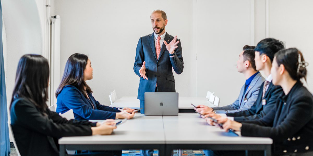 teacher informing hospitality students of hospitality industry training