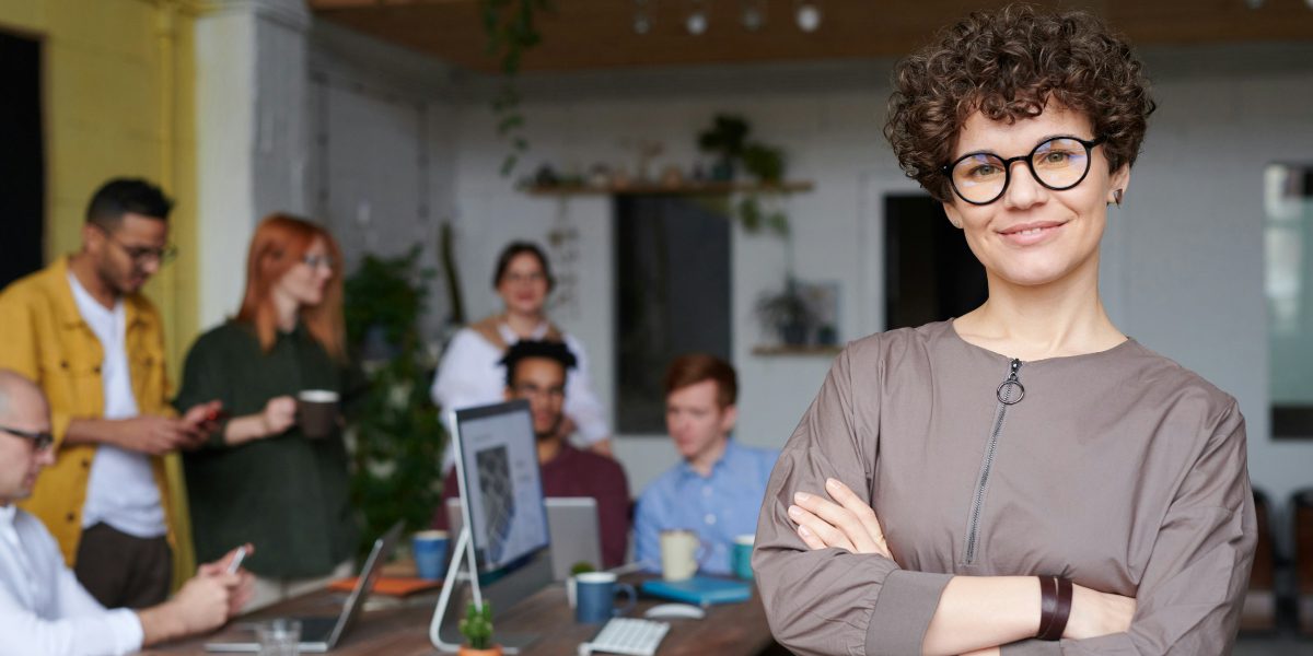 professional woman in mice business with her team